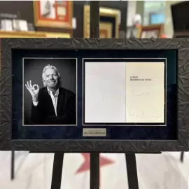The book "Screw Business as Usual" signed by entrepreneur Richard Branson
