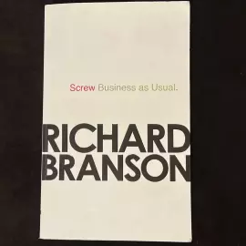 The book "Screw Business as Usual" signed by entrepreneur Richard Branson