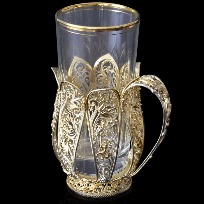 Inspiration cup holder made of silver with gilding