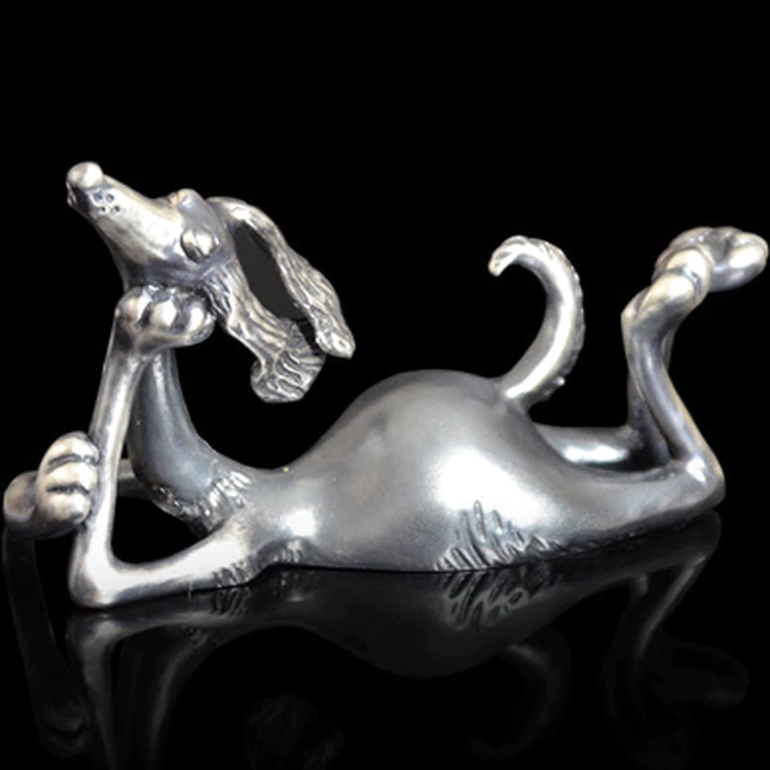 Silver figurine "The dog lies"