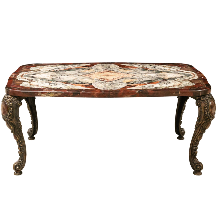 A table made of a cut of natural jasper with curly bronze legs. Collector's sample
