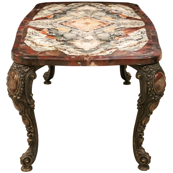 A table made of a cut of natural jasper with curly bronze legs. Collector's sample