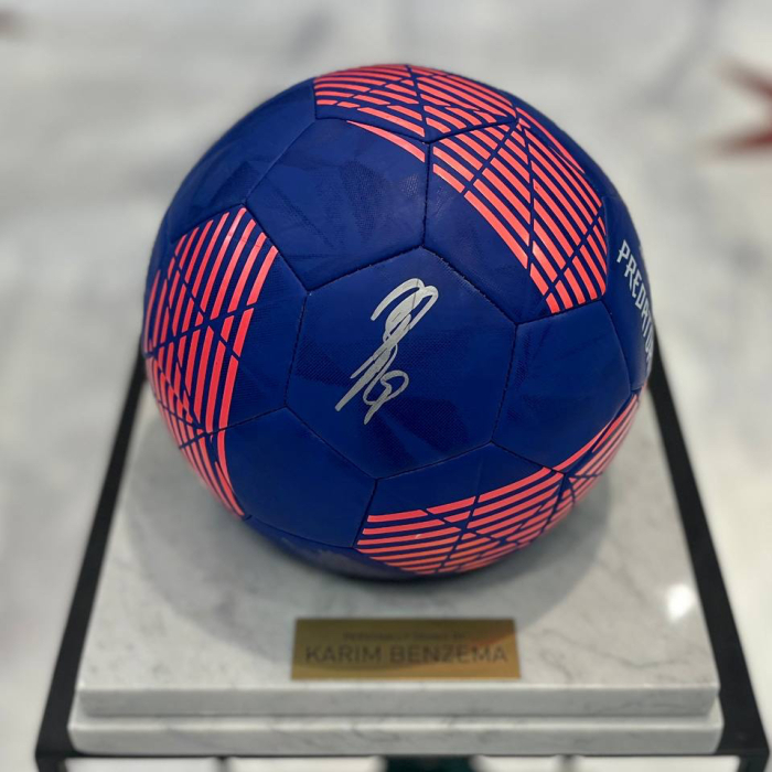 The ball with the autograph of footballer Karim Benzema, white marble