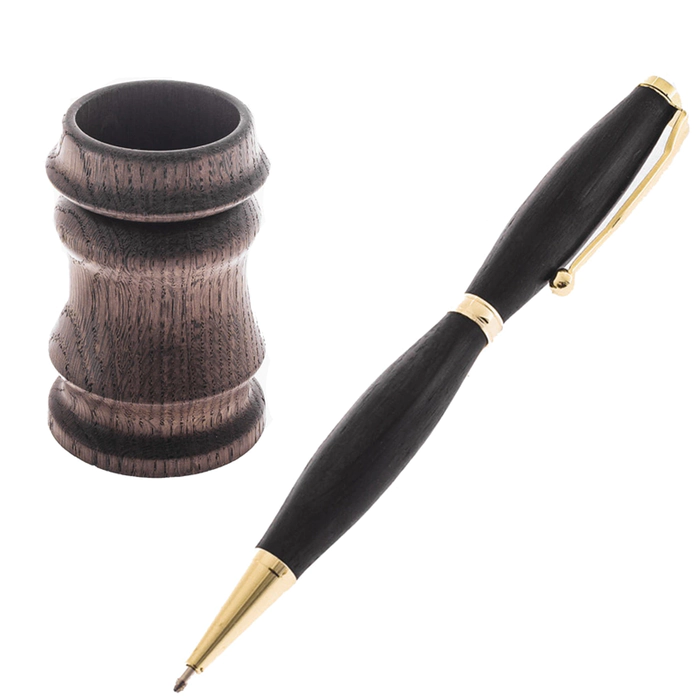 A pen and pencil holder made of stained oak