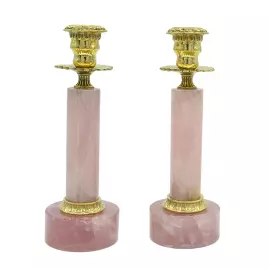 A pair of rose quartz candlesticks