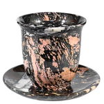 A cup and saucer made of jasper