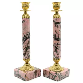 A pair of rhodonite candlesticks