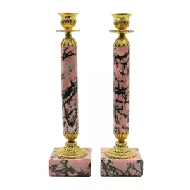 A pair of rhodonite candlesticks
