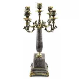 A candelabrum made of rauchtopaz with bronze