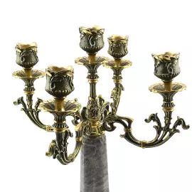 A candelabrum made of rauchtopaz with bronze