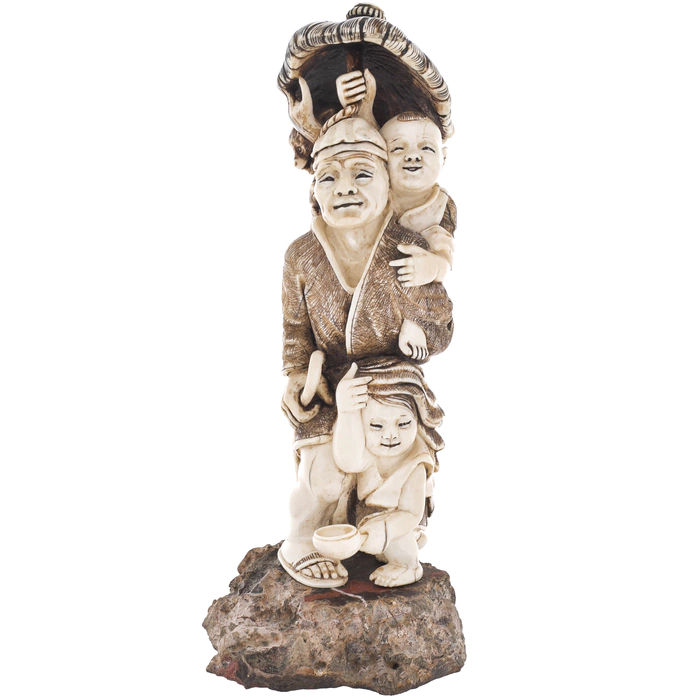 A souvenir from a mammoth tusk "A family with a monkey under an umbrella"
