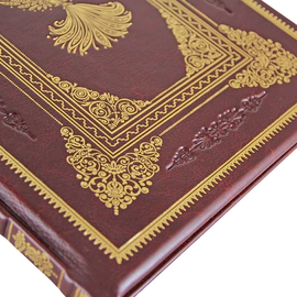 The leather-bound book "Russian folk tales. Palekh, mstera, lackey" in English