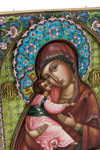 Silver icon with the inscription "Mother of God of Vladimir"