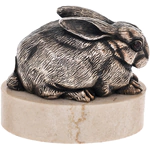 Bronze sculpture "Rabbit lying" on marble