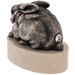 Bronze sculpture "Rabbit lying" on marble