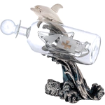 Statuette "Dolphin with a bottle" with silver coating