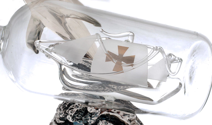 Statuette "Dolphin with a bottle" with silver coating