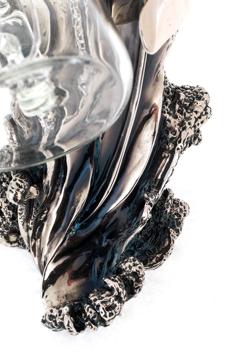 Statuette "Dolphin with a bottle" with silver coating