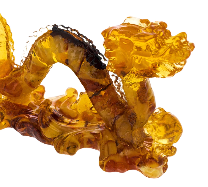 Amber sculpture "Dragon with a ball", light