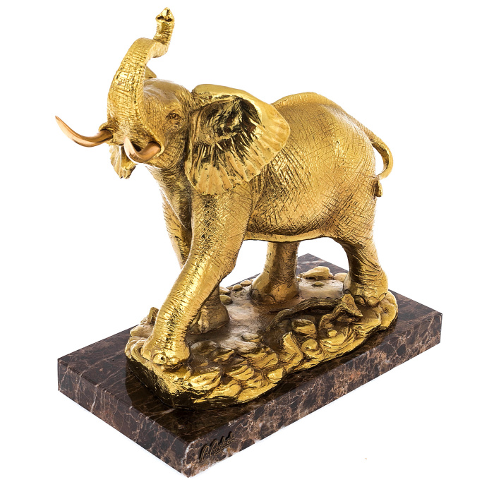 Golden elephant sculpture with gilding
