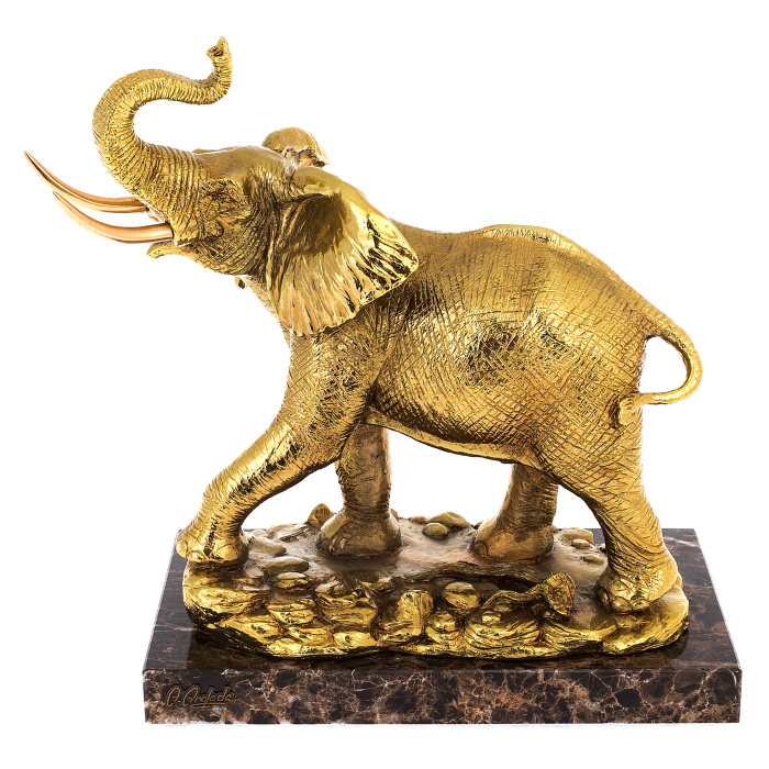 Golden elephant sculpture with gilding