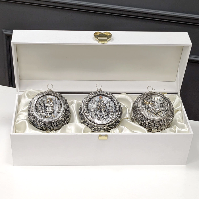 A set of 3 silver Christmas tree balls "Happy Childhood" in a gift box