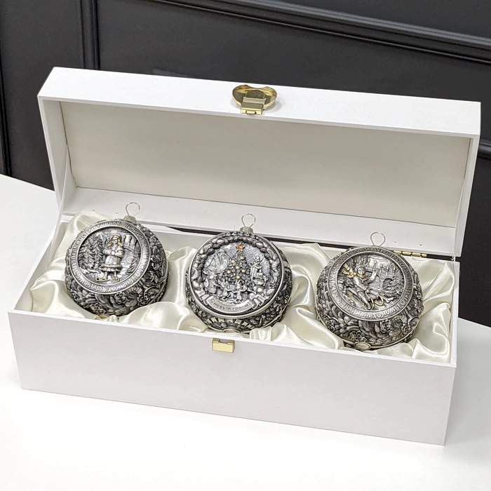 A set of 3 silver Christmas tree balls "Happy Childhood" in a gift box
