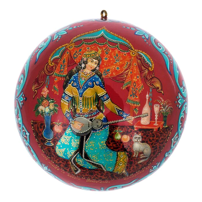 A set of wooden Christmas tree balls "Palekh fairy tales" in a gift box