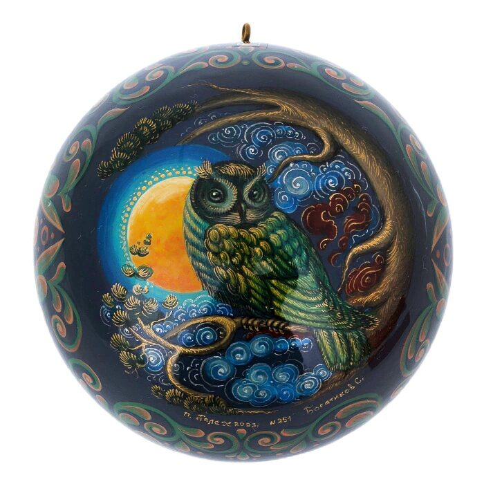 A set of wooden Christmas tree balls "Palekh fairy tales" in a gift box