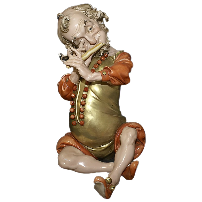 The statuette "The Dwarf plays the pipe"