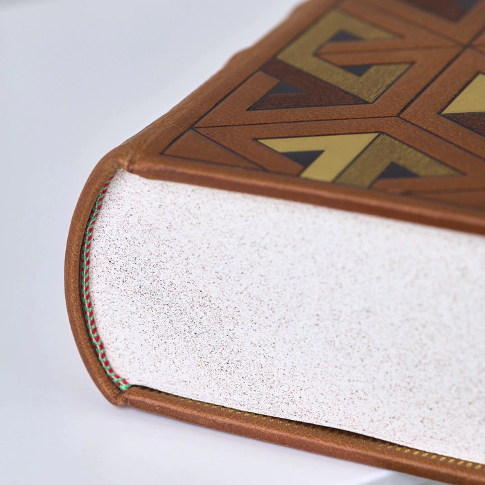 The leather-bound book "Fundamentals of Chemistry" by D.I. Mendeleev