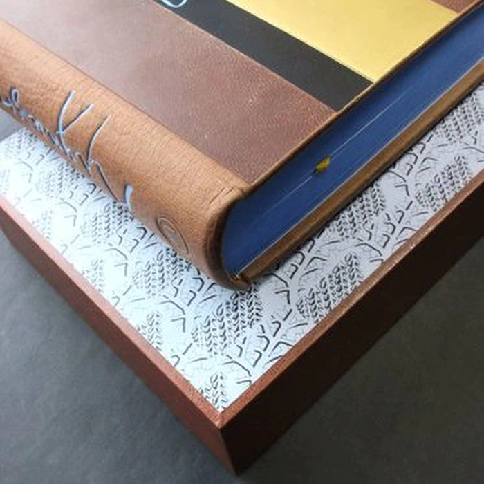 The leather-bound book "Grains of Truth" by K. Paustovsky