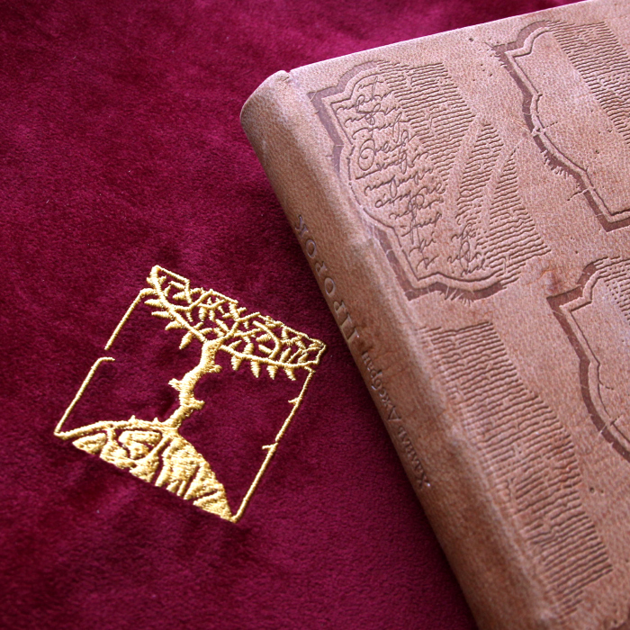 The leather-bound book "The Prophet" by Gibran H.