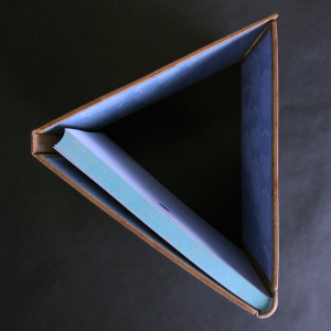 The leather-bound book "The Prophet" by Gibran H.