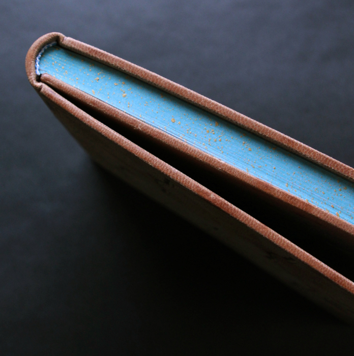 The leather-bound book "The Prophet" by Gibran H.
