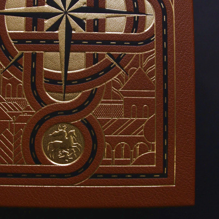 A leather-bound book "Description of a trip to Muscovy and through Muscovy to Persia and back" by Olearius A.