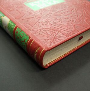 The leather-bound book "The Kitchen of the Century."