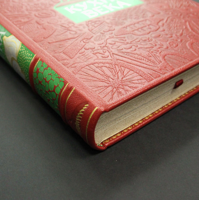 The leather-bound book "The Kitchen of the Century."