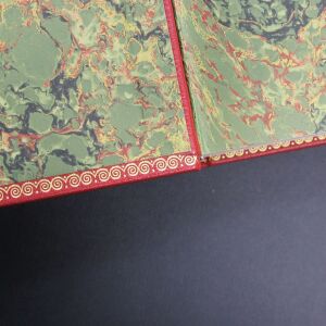 The leather-bound book "The Kitchen of the Century."