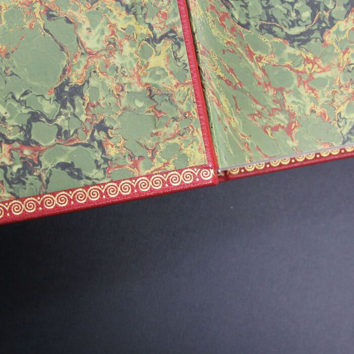 The leather-bound book "The Kitchen of the Century."
