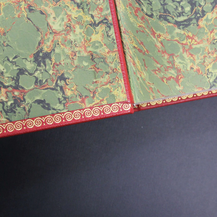 The leather-bound book "The Kitchen of the Century."