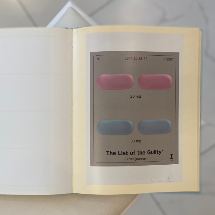 A book with a handwritten wish, drawing and autograph by artist Damien Hirst