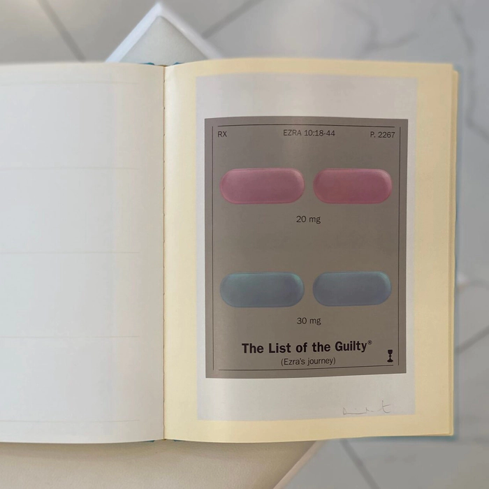A book with a handwritten wish, drawing and autograph by artist Damien Hirst