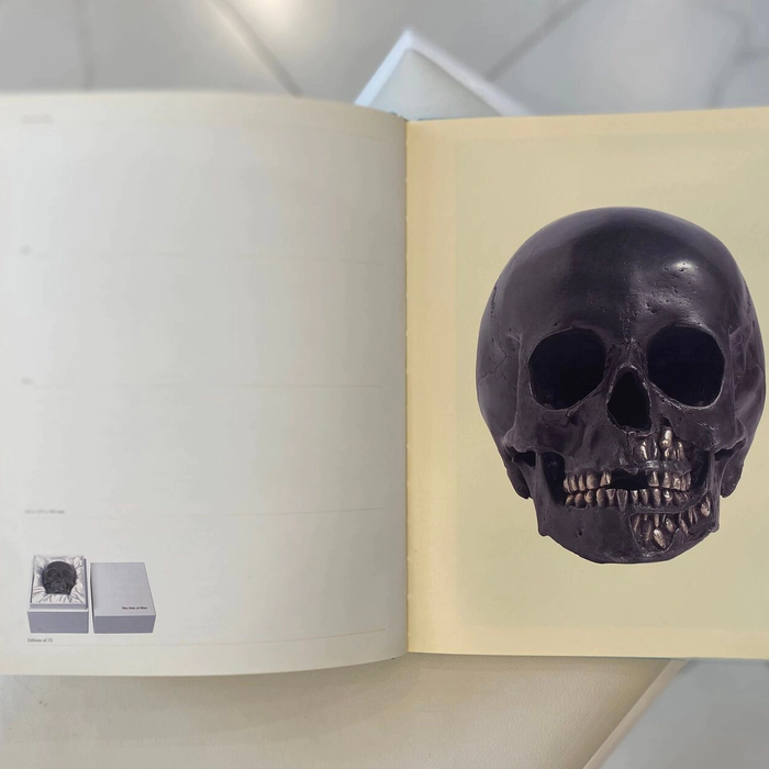A book with a handwritten wish, drawing and autograph by artist Damien Hirst