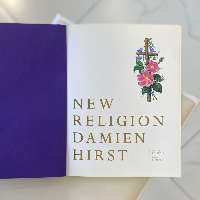 A book with a handwritten wish, drawing and autograph by artist Damien Hirst