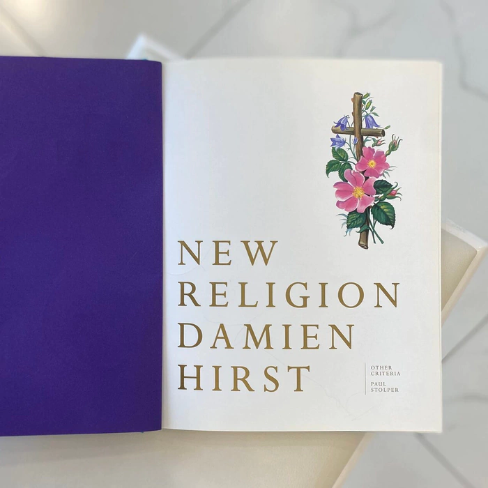 A book with a handwritten wish, drawing and autograph by artist Damien Hirst