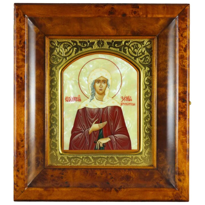 Icon in a gold frame and a kiosk "Xenia of St. Petersburg" on natural mother-of-pearl