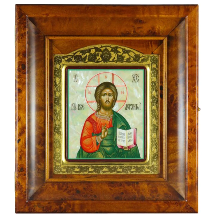 Icon of the Savior in a gold frame and a kiosk on natural mother-of-pearl