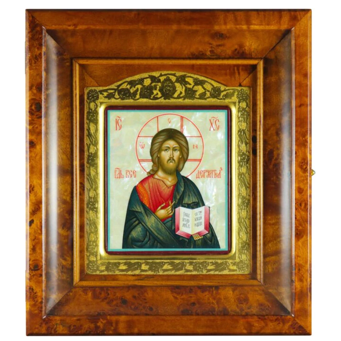 Icon of the Savior in a gold frame and a kiosk on natural mother-of-pearl