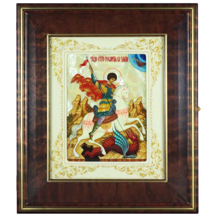 The icon of St. George the Victorious in a white frame and a kiosk on natural mother-of-pearl